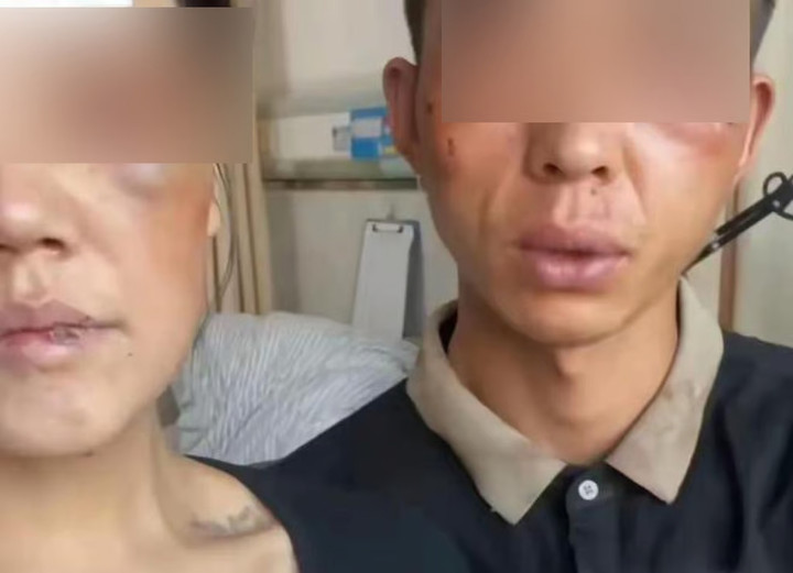 Cặp vợ chồng đi vay tiền, bị nhân viên ngân hàng tấn công. (Ảnh: SCMP)