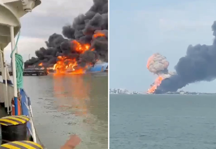 Khói và lửa bốc lên từ chiếc phà tại cảng Kavkaz mà Nga cáo buộc Ukraine tấn công. (Ảnh: Reuters)