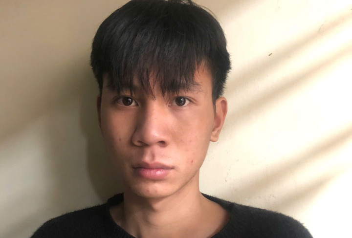 Trần Đình Minh tại cơ quan công an.