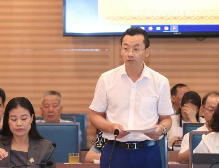 Phó Giám đốc Sở Văn hóa và Thể thao Hà Nội Phạm Xuân Tài báo cáo tại cuộc họp.