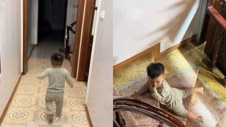 Em bé đi cầu thang theo tư thế độc đáo khiến dân mạng có nhiều quan điểm trái chiều.
