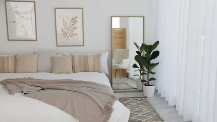 Gương giúp phòng ngủ trông rộng hơn. (Ảnh: Nội thất Lam Sơn)