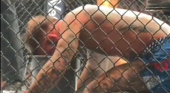 Garbrandt nôn vào xô sau khi trúng cú đá vào vùng nhạy cảm