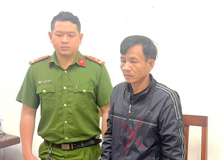 Nguyễn Văn Hải (x) tại cơ quan Công an. (Ảnh T.B)