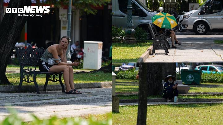 Nhiều người cũng tranh thủ ghé công viên trú nắng giữa thời tiết oi bức.