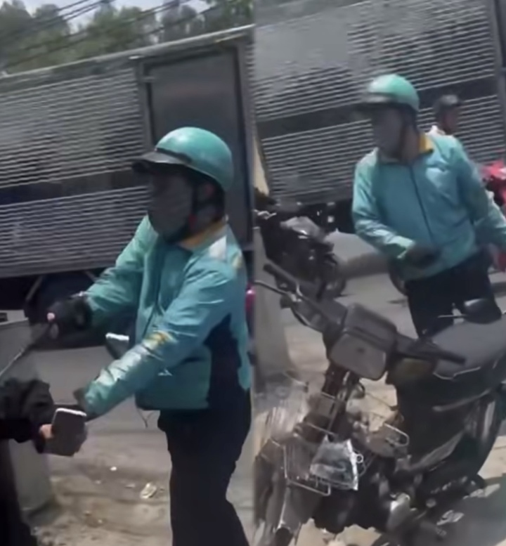 Tài xế xe công nghệ dùng gậy sắt đánh người. (Ảnh cắt từ clip)