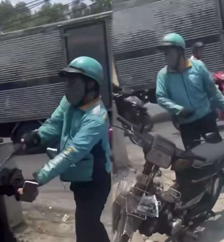 Trần Văn Hoà cầm gậy đánh người. (Ảnh chụp màn hình)