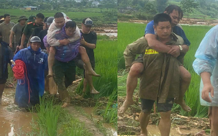Công an xã Mường Than giải cứu thành công 2 người dân mắc kẹt giữa dòng lũ. (Nguồn: Công an Lai Châu)