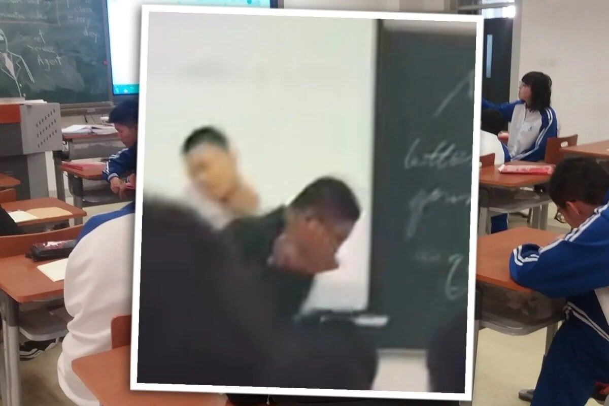 Nam sinh tấn công, bóp cổ thầy giáo vì bị thu điện thoại trong giờ học. (Ảnh: SCMP)